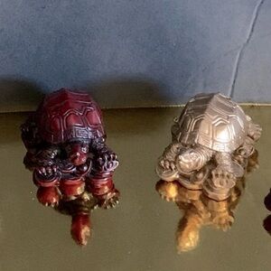 Feng Shui Mini Turtle Figurines made of Resin in 2 colors; Gold and Mahogany.